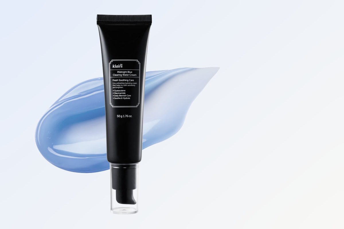 Midnight Blue Clearing Water Cream tube with blue gel texture swatch on a pale blue gradient