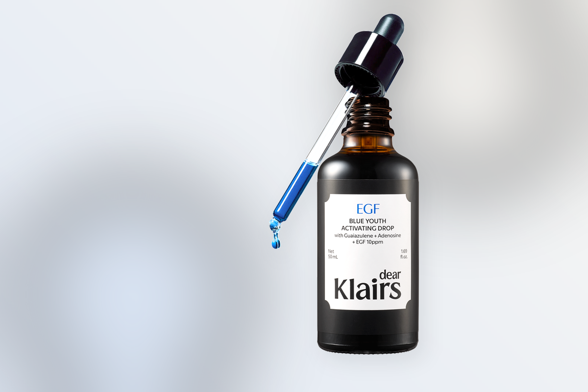 Klairs EGF Blue Youth Activating Drop serum bottle on a soft neutral gradient background