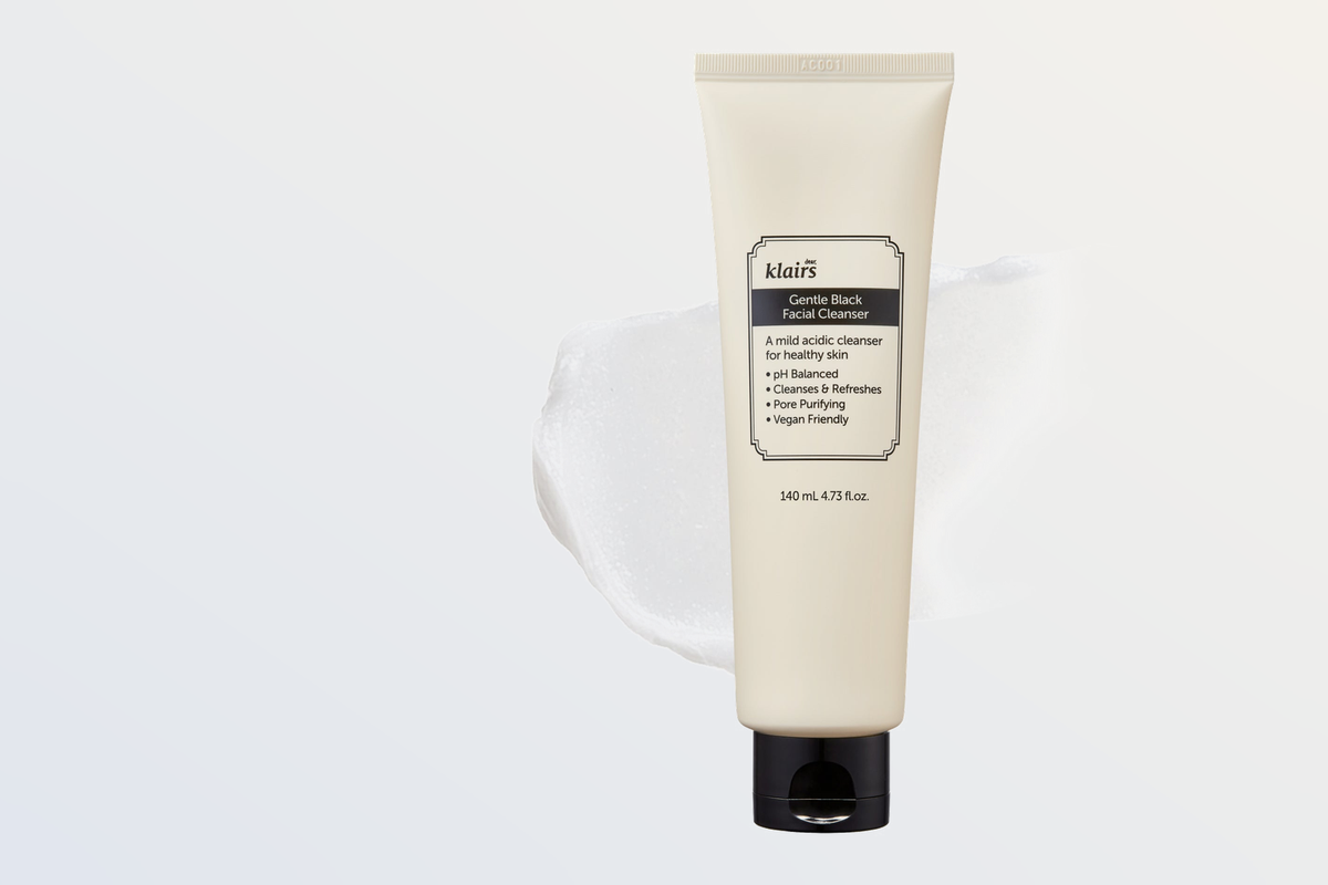 Gentle Black Facial Cleanser tube on a soft neutral gradient background