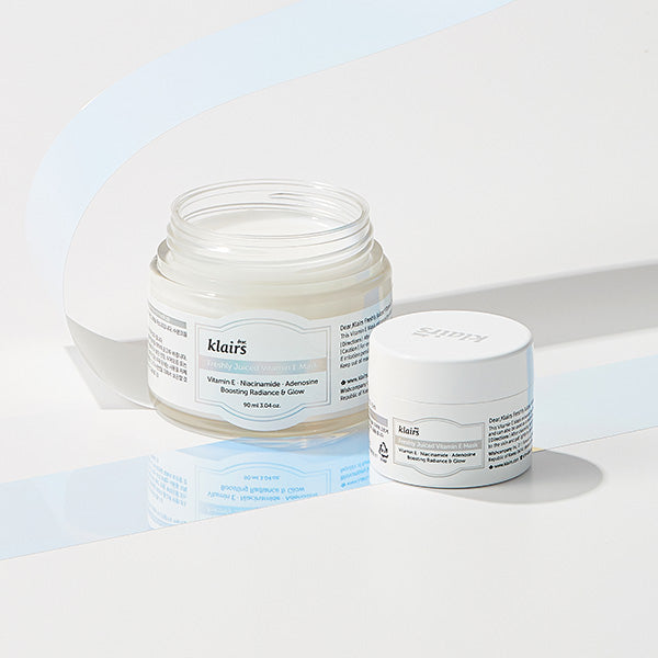 Open jar of Freshly Juiced Vitamin E Mask showing white cushion cream texture beside miniature size