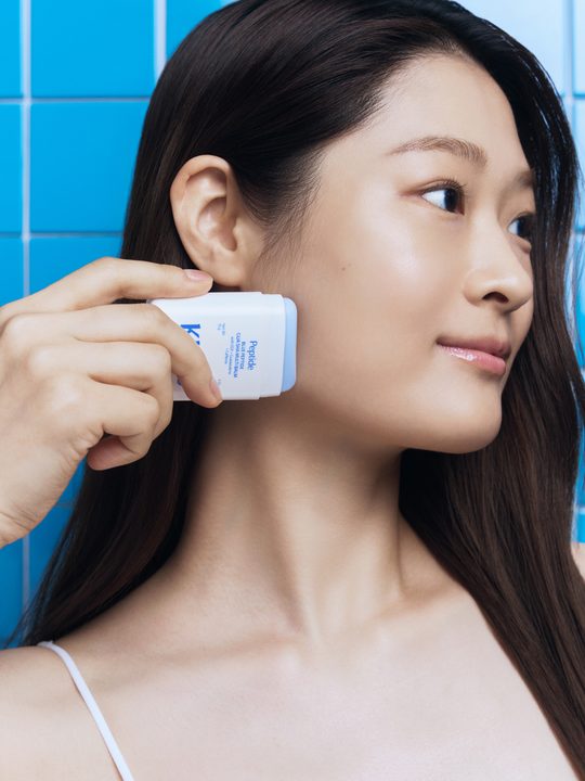 Using the Blue Peptide Gua Sha Multi Balm along the cheek