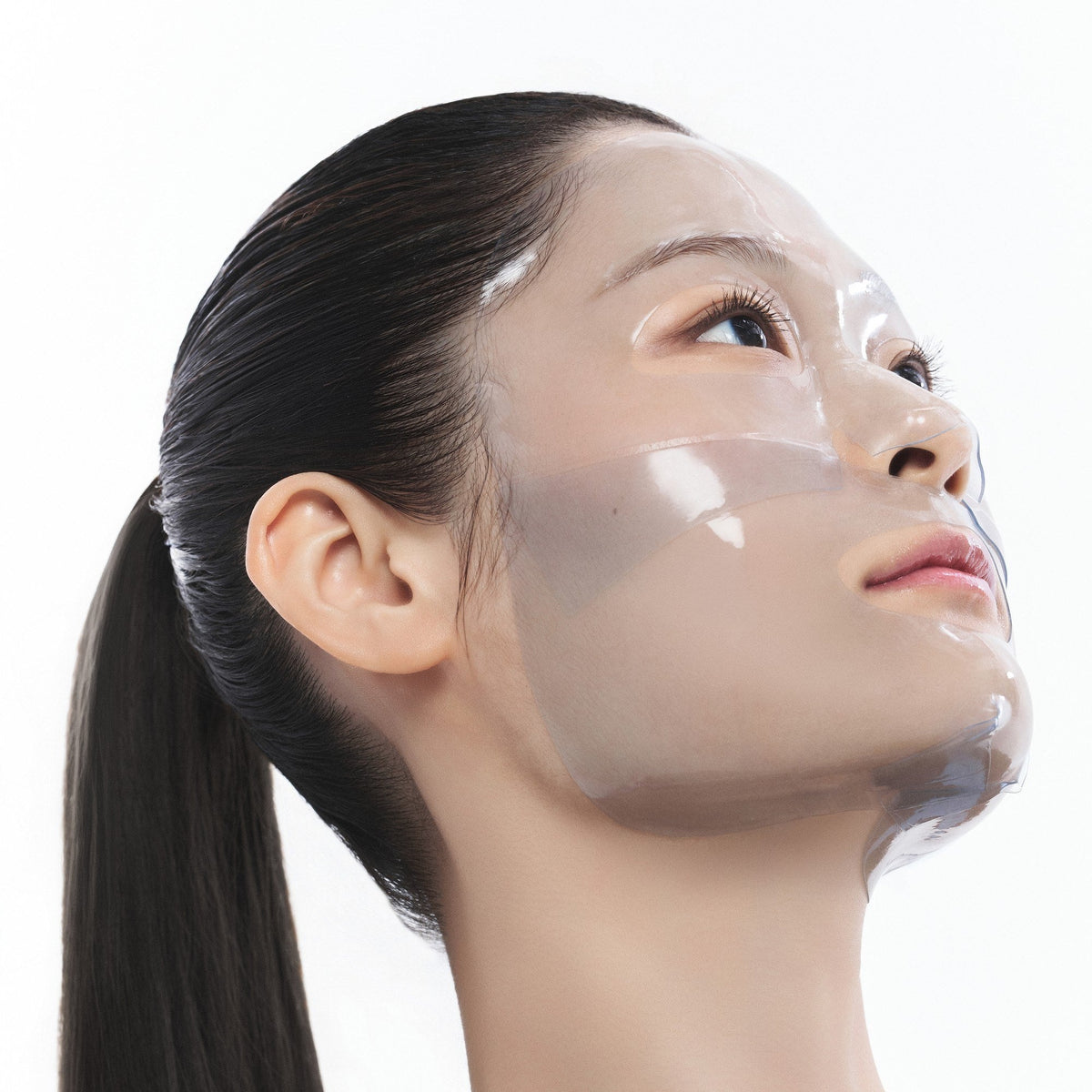 Model wearing the Blue EGF Calming Gel Mask from eyes to jawline