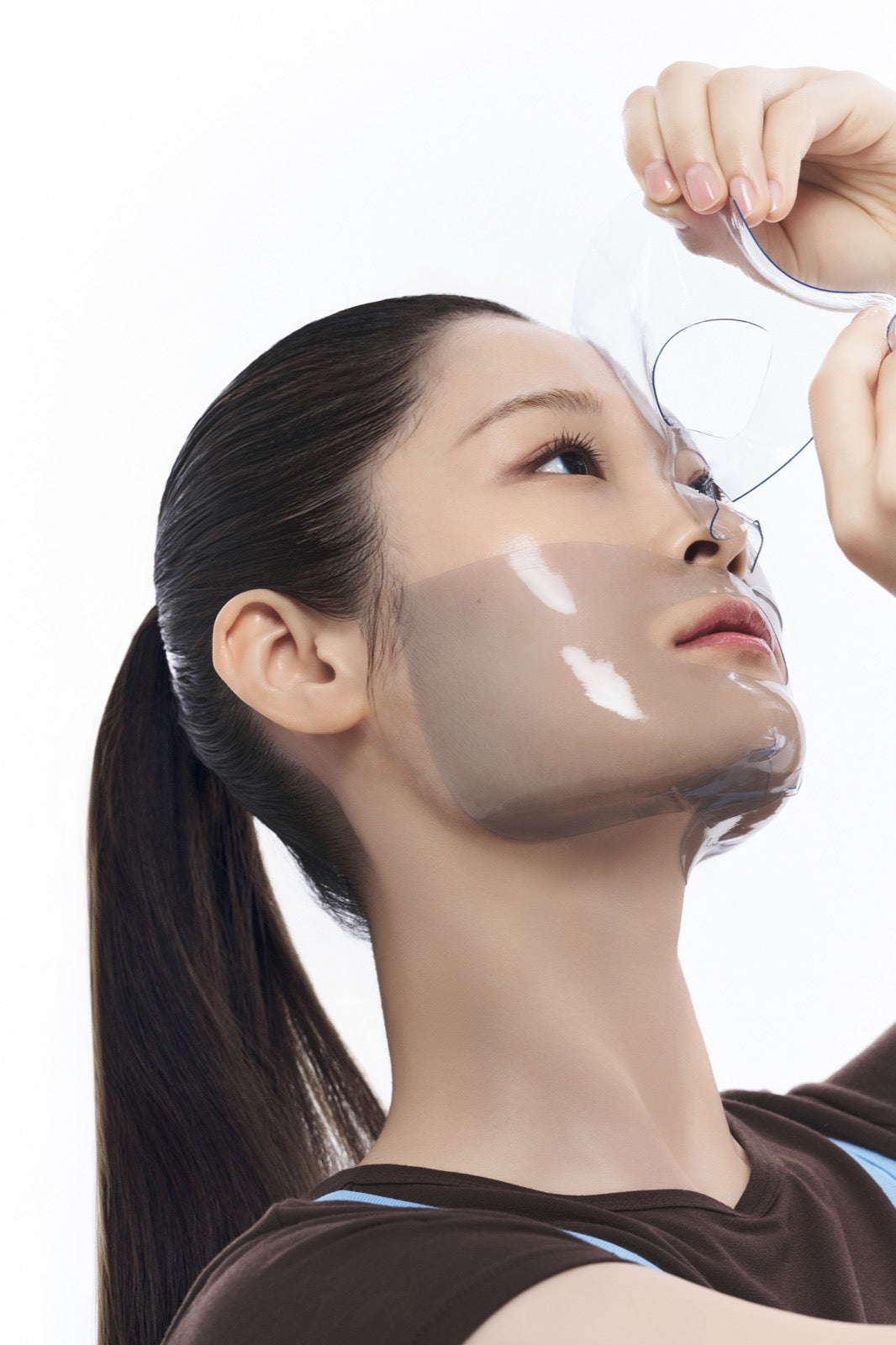 Peeling off the Blue EGF Calming Gel Mask after 30 minutes